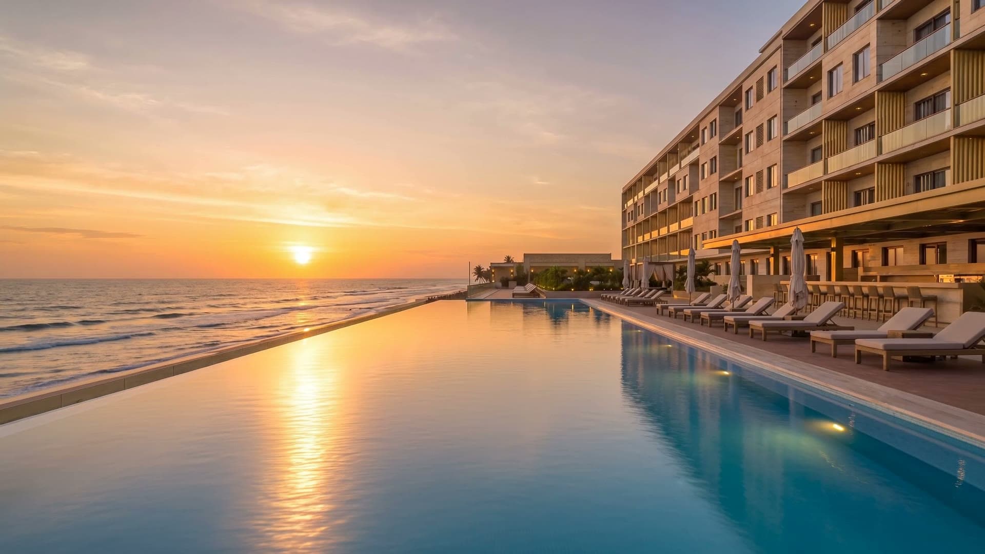 NJS Royale second-floor ocean-facing pool terrace at sunset over the Atlantic
